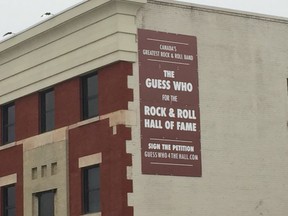 A sign promoting a petition to get The Guess Who into the Rock & Roll Hall of Fame seen in Winnipeg on Thursday, Jan. 7.