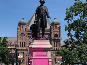 Protesters vandalized a statue of Sir John A. Macdonald at Queens Park on July 18, 2020.