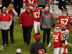 Kansas City Chiefs tight end Travis Kelce (87) and head coach Andy Reid celebrate the victory against the Cleveland Browns in the AFC Divisional Round playoff game at Arrowhead Stadium in Kansas City.