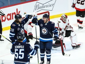 Winnipeg Jets forward Paul Stastny (25) celebrates with teammates after scoring a goal against the Ottawa Senators during the third period at Bell MTS Place. Terrence Lee-USA TODAY Sports
