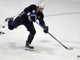Mathieu Perreault rips a shot during Winnipeg Jets training camp at Bell MTS Iceplex in Winnipeg on Sunday.