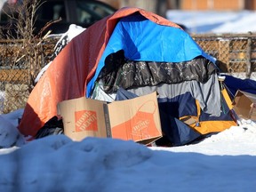 A tent covered in blankets and tarps, and surrounded with cardboard, near a homeless shelter, in Winnipeg on Tuesday, Jan. 26,  2021. Chris Procaylo/Winnipeg Sun