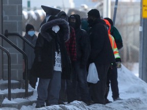 People line up near Siloam Mission, in Winnipeg on Tuesday, Jan. 26, 2021.