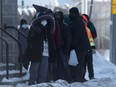 People line up near Siloam Mission, in Winnipeg on Tuesday, Jan. 26, 2021.