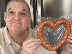 Hal Anderson with a heart-shaped kobassa from Tenderloin Meat & Sausage at 1515 Main St.