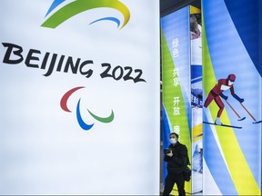 A journalist looks at a display at the exhibition center for the Beijing 2022 Winter Olympics in Yaqing district on Feb. 5, 2021 in Beijing, China.