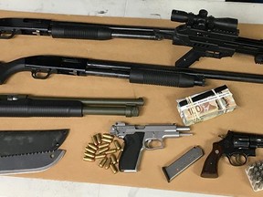 The search resulted in approximately six grams of cocaine, an undisclosed amount of Canadian currency, drug trafficking paraphernalia, various electronics, and five firearms, including a sawed off shotgun and two handguns with readily accessible ammunition.
