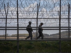 This file photo taken on April 23, 2020 shows South Korean soldiers patrolling along the Demilitarized Zone (DMZ) separating North and South Korea.