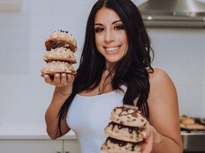 Winnipeg's Sabrina Reid poses with cookies that she makes for her business the Cookie Craving Co.