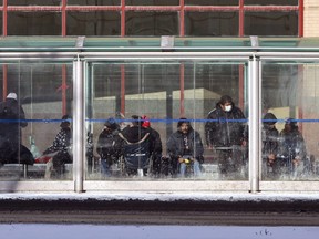 A crowded bus shack in front of Portage Place in Winnipeg on Sunday, Jan. 31.