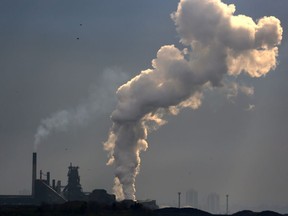 Steam rises from a plant in an industrial zone in Hamilton, Ont., May 13, 2017.