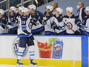 Winnipeg Jets forward Blake Wheeler (26) celebrates a third period goal against the Edmonton Oilers at Rogers Placein Edmonton on Monday, Feb. 15, 2021.