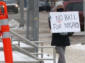 A group of people assembled near the law courts in Winnipeg to oppose a bail application made by lawyers representing Peter Nygard on Wednesday, Feb. 3, 2, 2021. Chris Procaylo/Winnipeg Sun