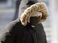 Frost forms on the eyelids of a woman walking in downtown Winnipeg on Monday, Feb. 8, 2021.