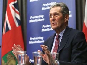 Premier Brian Pallister speaks during a press conference announcing the easing of some COVID-19 restrictions, at the Manitoba Legislative Building in Winnipeg, on Tuesday.