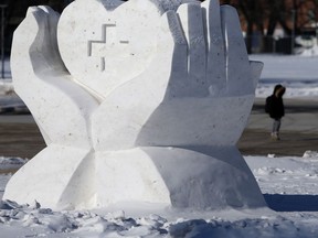 A snow sculpture, that is a tribute to health care workers, in front of the Manitoba Legislative Building, in Winnipeg on Friday, Feb. 12, 2021.