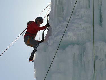 An ice climber ascends the east wall at the Club d'escalade Saint-Boniface in Winnipeg on Sunday, Feb. 21, 2021.