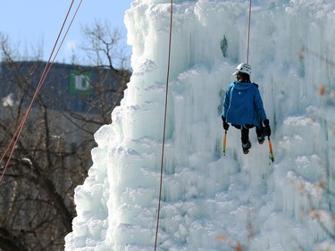 An ice climber rappels the east wall at the Club d'escalade Saint-Boniface in Winnipeg on Sunday, Feb. 21, 2021.