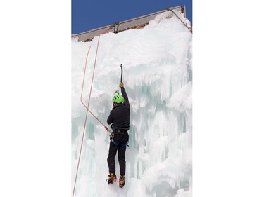 An ice climber ascends the south wall at the Club d'escalade Saint-Boniface in Winnipeg on Sunday, Feb. 21, 2021.