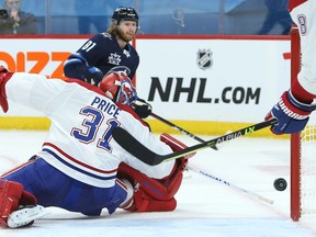 Montreal Canadiens goaltender Carey Price is beaten by Winnipeg Jets forward Kyle Connor in Winnipeg on Thurs., Feb. 25, 2021.