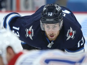 Winnipeg Jets forward Pierre-Luc Dubois readies for the drop of the puck against the Montreal Canadiens in Winnipeg on Thurs., Feb. 25, 2021. Kevin King/Winnipeg Sun/Postmedia Network