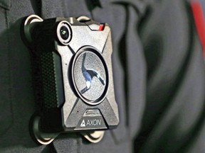 A Calgary police officer display the force's body cam.