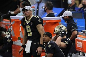 New Orleans' Jameis Winston (sitting) talked glowingly of Drew Brees on Tuesday.