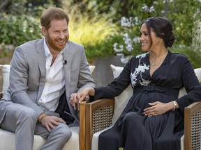 So, then the queen says... This image provided by Harpo Productions shows Prince Harry, left, and Meghan, Duchess of Sussex, speaking about expecting their second child during an interview with Oprah Winfrey.
