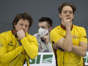 Team Manitoba skip Jason Gunnlaugson of Winnipeg Mb, (left) and third Adam Casey stand in the back of the house during draw 16 against team B.C. Curling Canada/ Michael Burns Photo