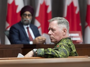 National Defence Minister Harjit Sajjan and Chief of Defence Staff Jonathan Vance listen to a question during a news conference Friday, June 26, 2020 in Ottawa.