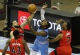 John Wall of the Houston Rockets loses the ball to Raptor Fred VanVleet as teammates Kyle Lowry and Pascal Siakam look on Monday night. Getty images