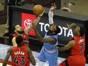 John Wall of the Houston Rockets loses the ball to Raptor Fred VanVleet as teammates Kyle Lowry and Pascal Siakam look on Monday night. Getty images