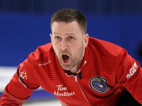Newfoundland and Labrador skip Brad Gushue yells instructions to his sweepers against Alberta during the final of the 2020 Tim Hortons Brier in Kingston on March 8, 2020.