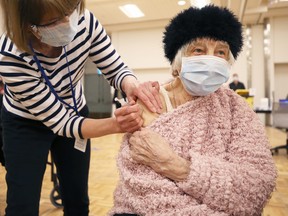 Nina Luhowy, 93, gets her shot at the COVID-19 vaccination super site at RBC Convention Centre in downtown Winnipeg on Monday, March 1, 2021.
