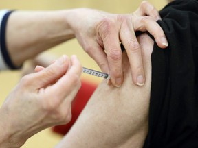 Needle into arm at the COVID-19 vaccination supersite at RBC Convention Centre in downtown Winnipeg on Monday, March 1, 2021.