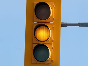 Amber traffic light in Winnipeg on Friday, March 12, 2021.