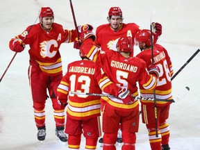 The Calgary Flames celebrate Mark Giordano’s goal against the Winnipeg Jets at the Saddledome in Calgary on Saturday, March 27, 2021. Gavin Young/Postmedia