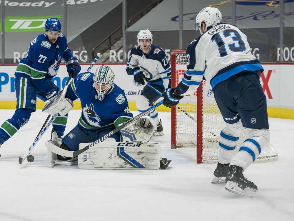 COVID sidelines Canucks, two Jets games postponed