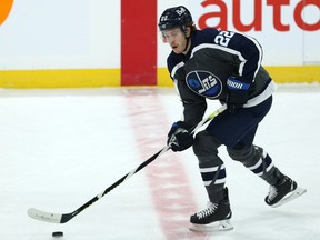 Winnipeg Jets forward Mason Appleton carries the puck against the Vancouver Canucks in Winnipeg on Tues., March 2, 2021. Kevin King/Winnipeg Sun/Postmedia Network