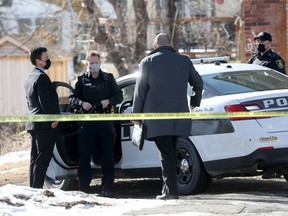 Police close to where human remains were recently discovered near the Red River and Alfred Avenue, in Winnipeg on Friday, March 5, 2021.