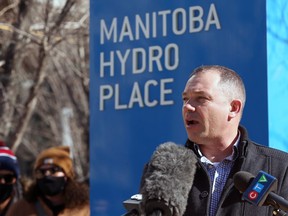 Mike Espenell, business manager of IBEW Local 2034, speaks during a rally at Manitoba Hydro Place in downtown Winnipeg on Sunday.