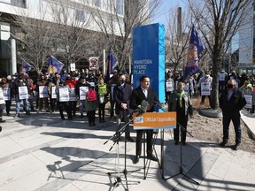 A look at the crowd gathered behind NDP Leader Wab Kinew as he speaks during a rally at Manitoba Hydro Place in downtown Winnipeg on Sunday, March 14, 2021.