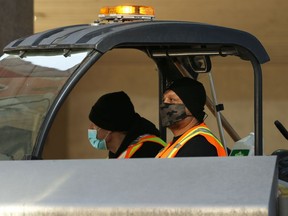 Members of the Downtown Winnipeg BIZ Enviro team at work in Winnipeg on Wed., March 17, 2021. Kevin King/Winnipeg Sun/Postmedia Network