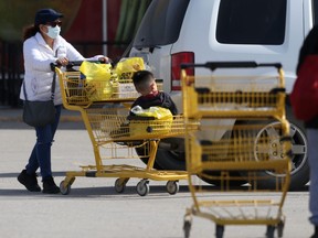 A woman and child take advantage of the first day of spring to do some shopping.