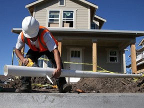 A worker builds a new home.