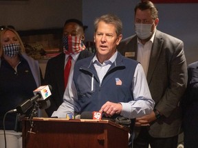 Georgia Gov. Brian Kemp speaks at a news conference about the state's new Election Integrity Law that passed last week at AJ’s Famous Seafood and Poboys in Marietta, Saturday, April 10, 2021.