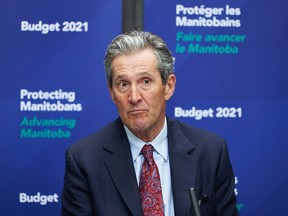 Premier of Manitoba Brian Pallister speaks at a news conference after the 2021 budget was delivered at the Manitoba Legislative Building in Winnipeg on Wednesday, April 7, 2021. THE CANADIAN PRESS/David Lipnowski