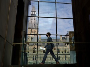 Prime Minister Justin Trudeau walks to a news conference, as efforts continue to help slow the spread of the coronavirus disease in Ottawa, April 13, 2021.