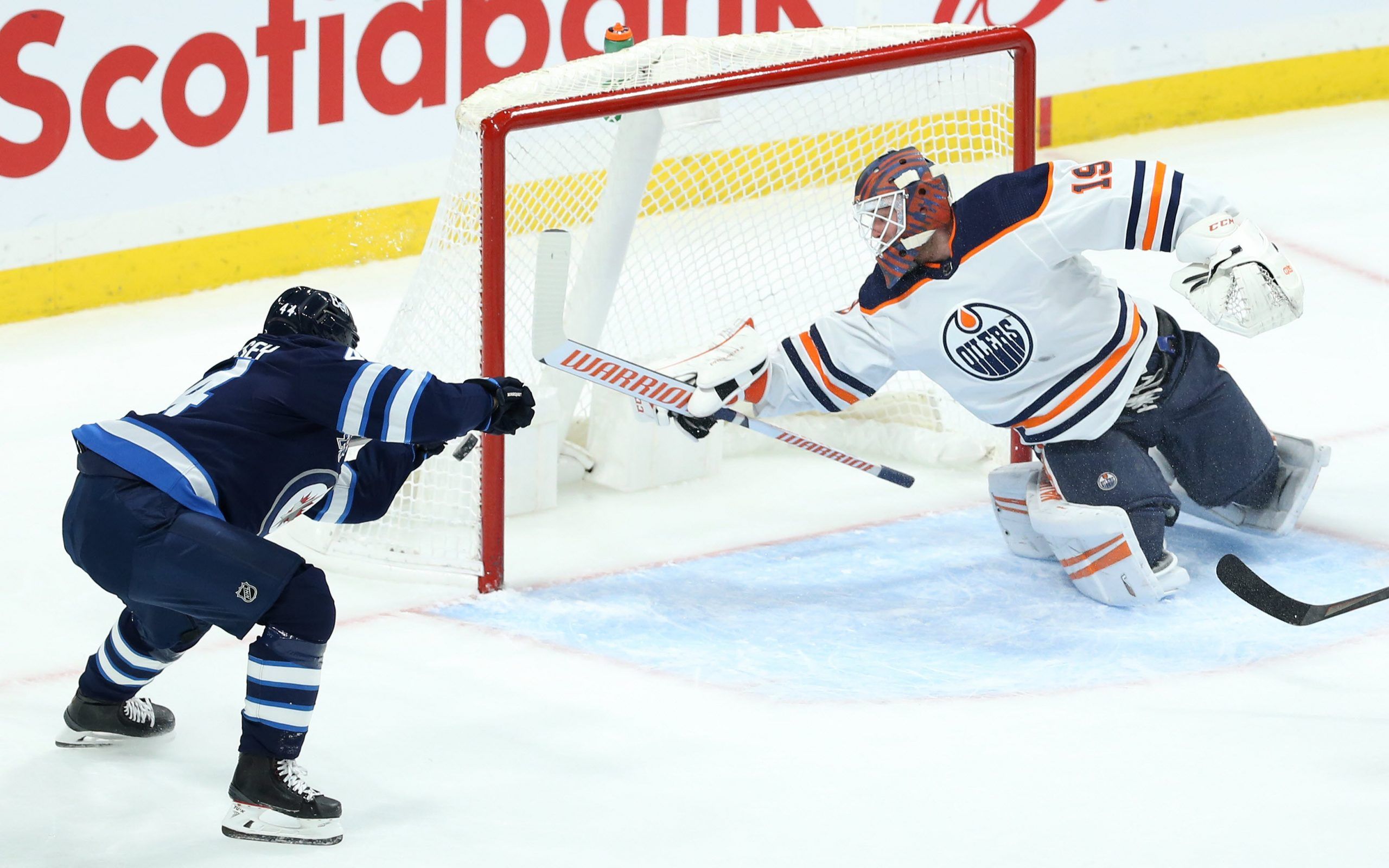 Hellebuyck, Pionk, Connor lead Jets to 2-1 win over Oilers - The