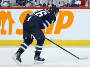 Jets captain heads to the bench during his game against the Toronto Maple Leafs on Thursday. Wheeler was not hurt, but three of his teammates left the game following altercations with Leafs players. KEVIN KING/WINNIPEG SUN